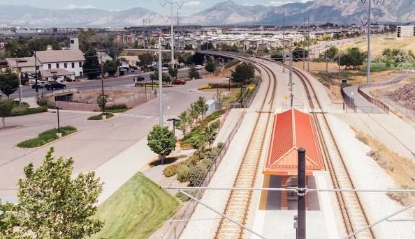 An aerial view of a residential neighborhood with mountains in the background.