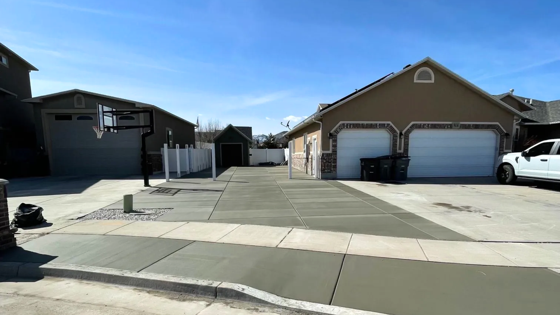 Northmen Concrete crew installing a concrete driveway in Syracuse Utah with forms and reinforcement