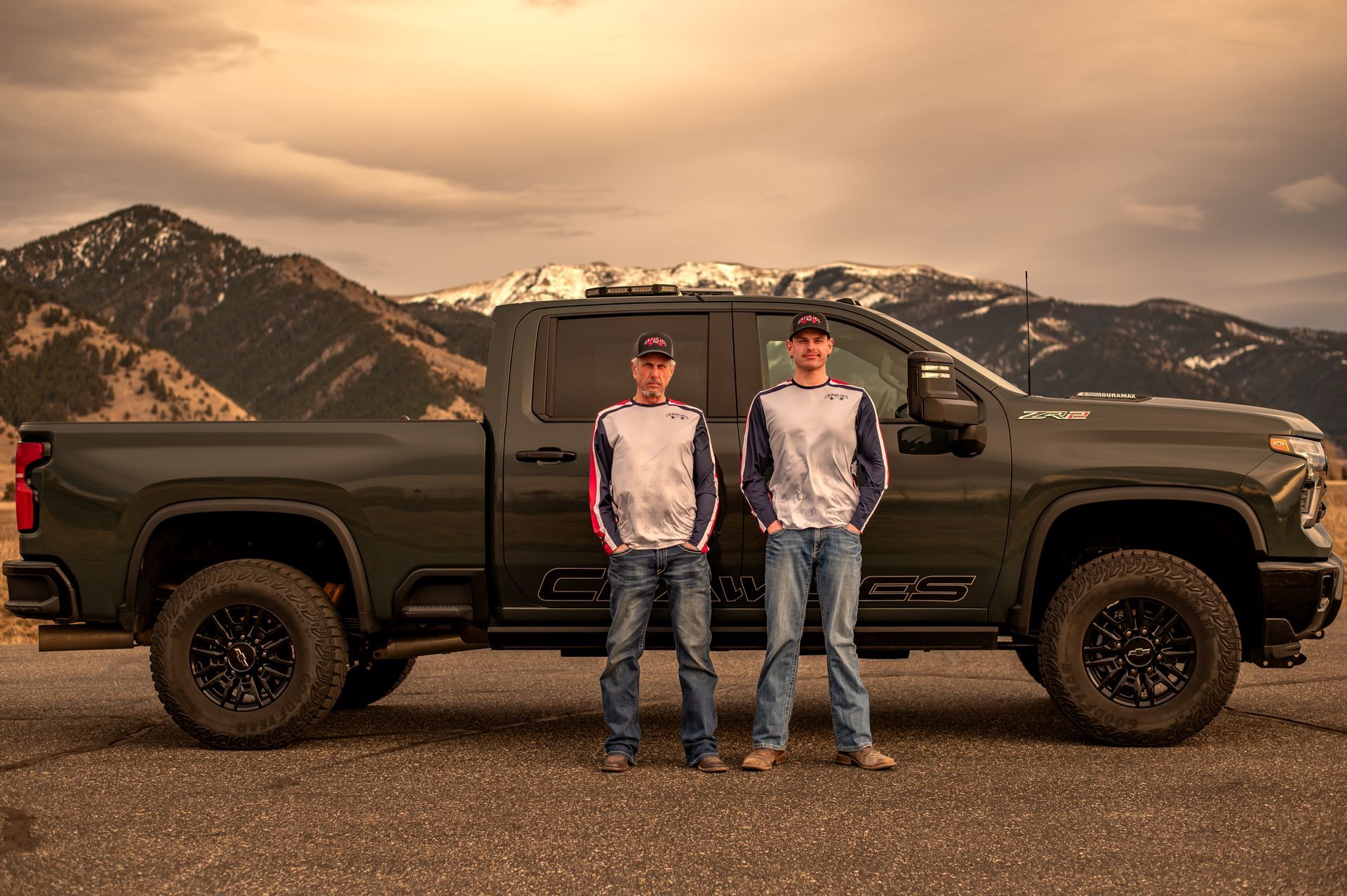 Crawlies P.C.O. logo with a white spider outline and text on black background,