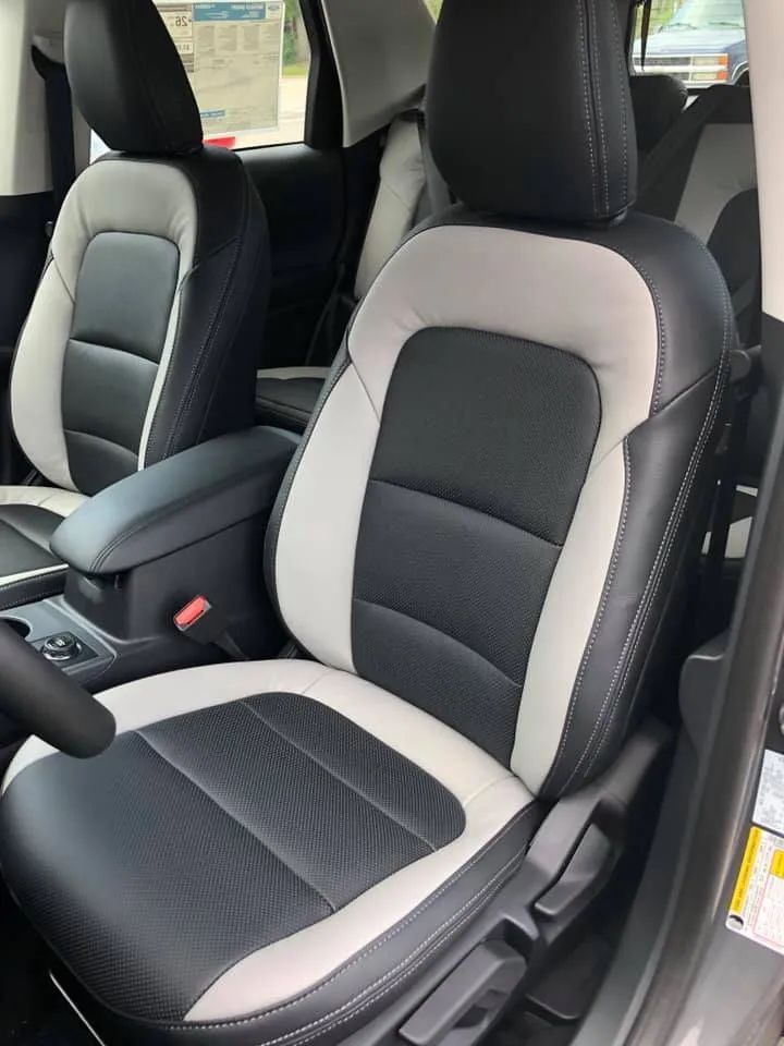 The front seats of a car are black and white
