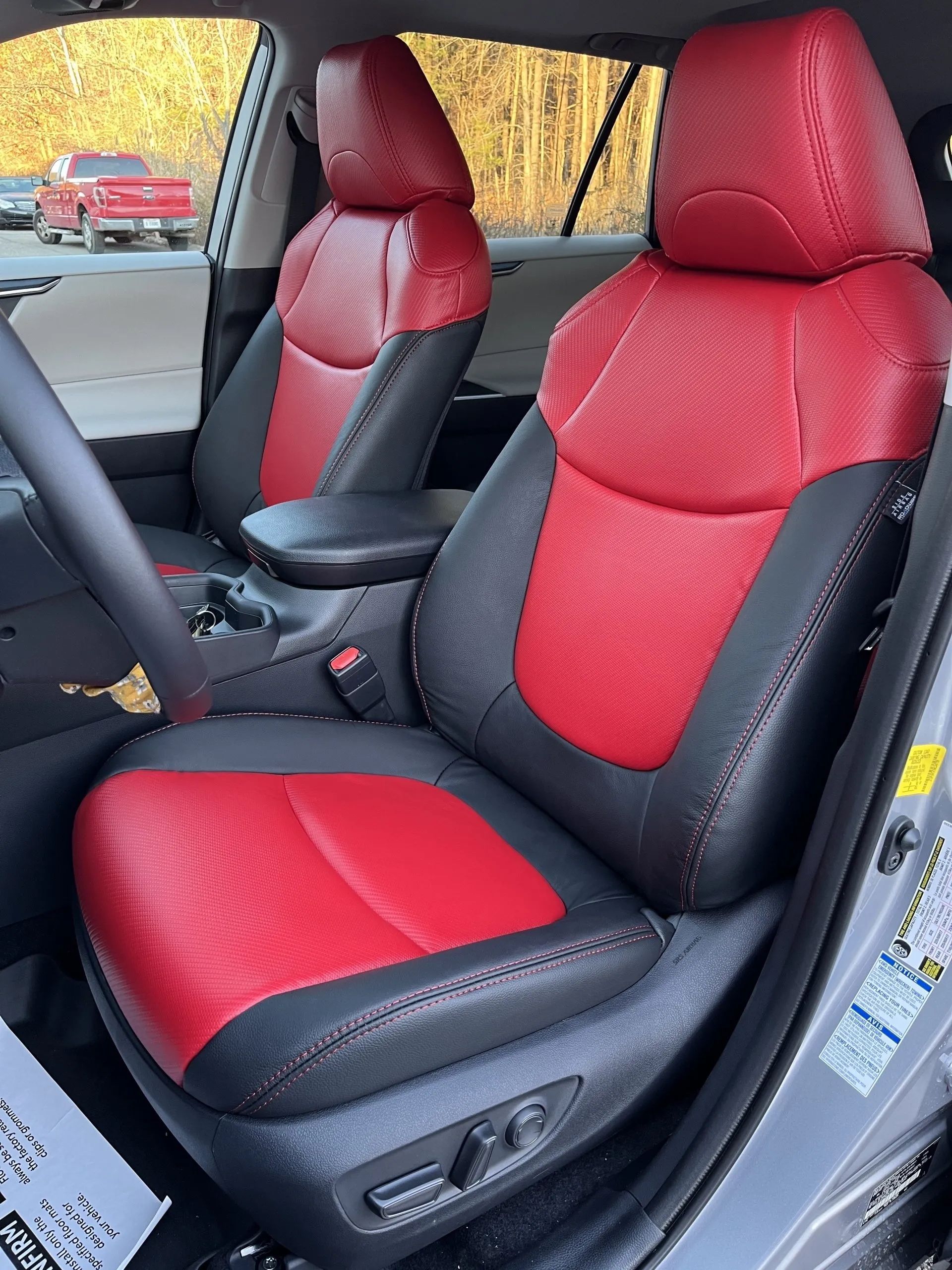 The front seats of a toyota rav4 are red and black