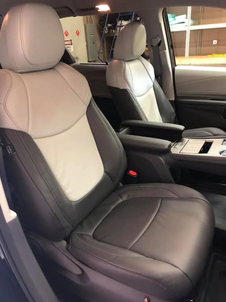 The front seats of a car are black and white