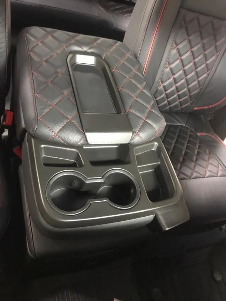 A car seat with a cup holder on it