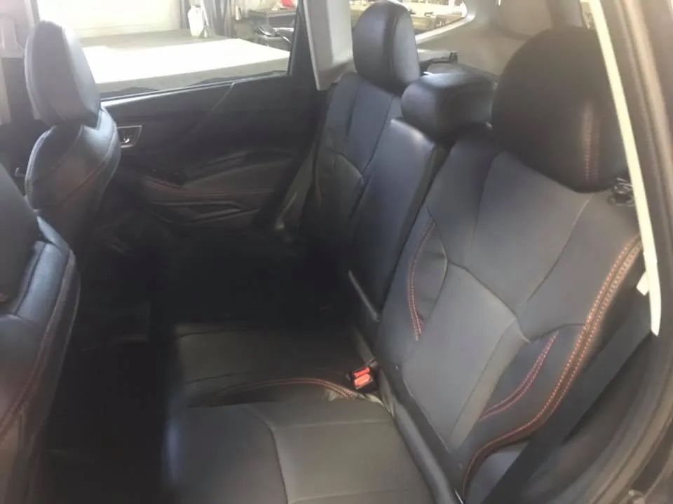 The back seat of a subaru forester is shown