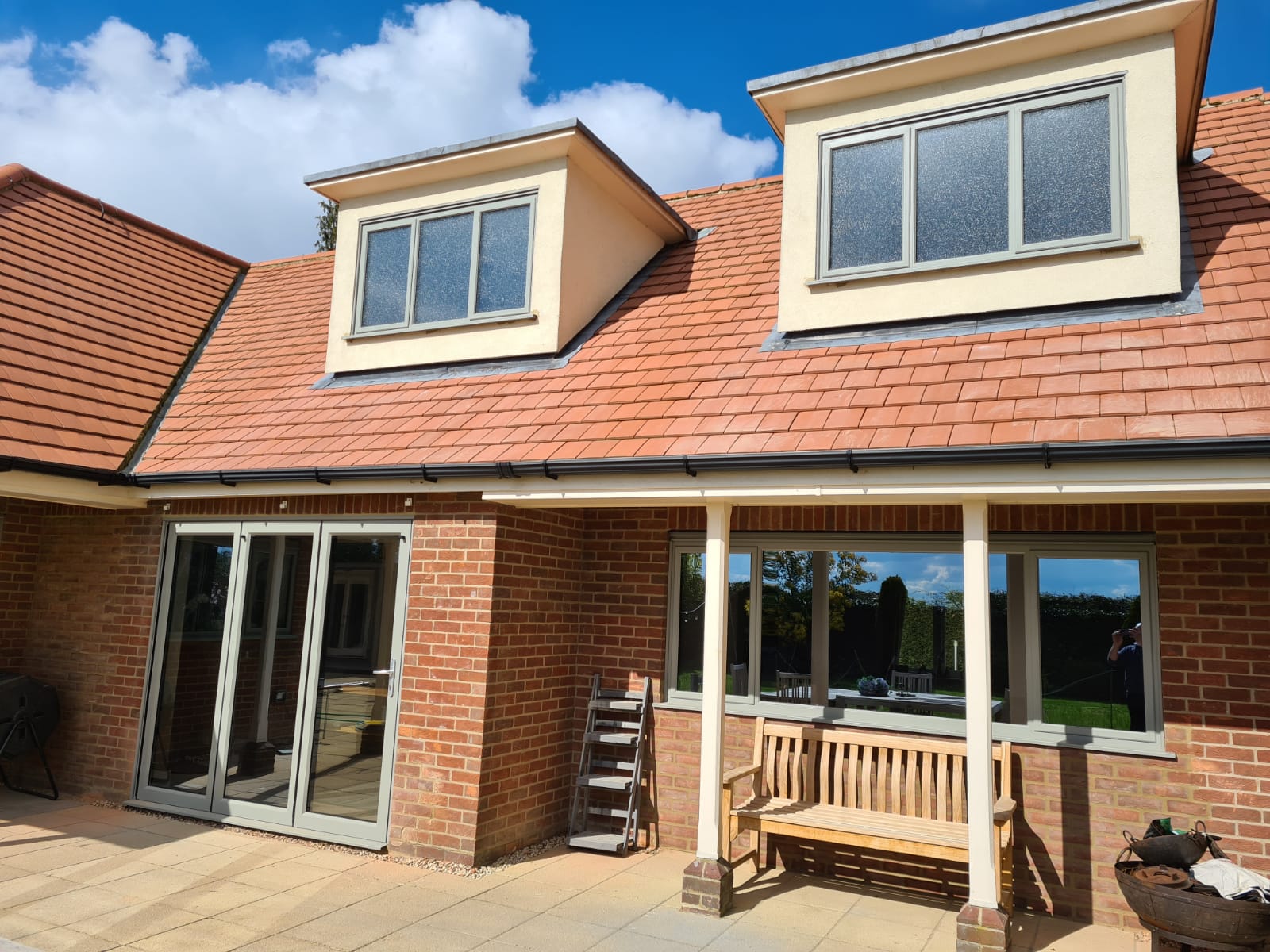Closed Aluminium Bifold Patio Doors on Brick Home