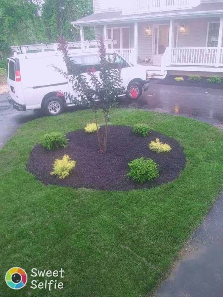 A white van is parked in the driveway of a house.