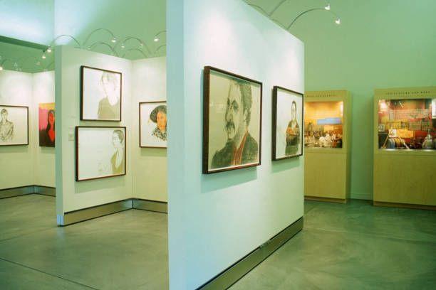 View of a museum space featuring museum lighting products above its paintings
