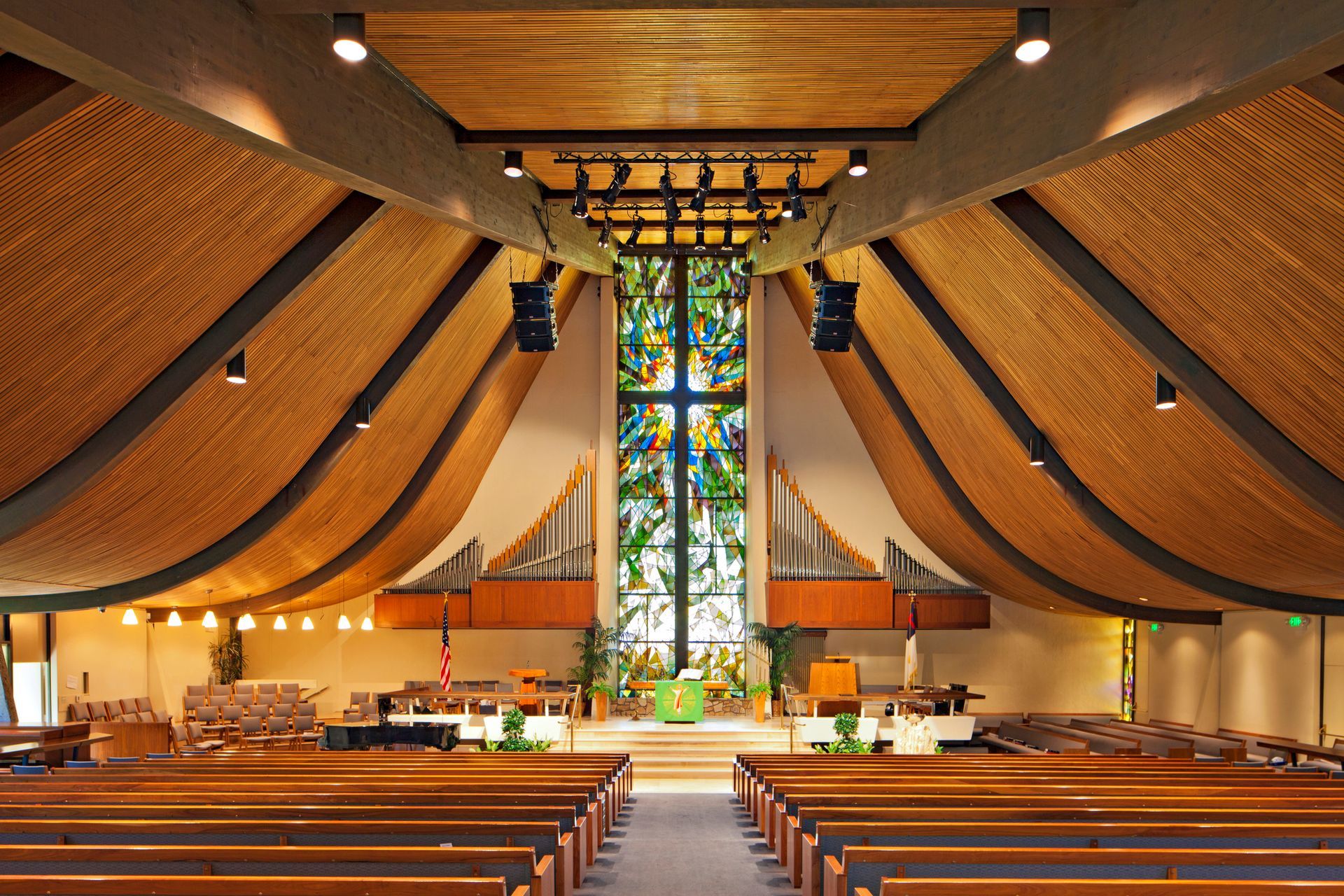 Interior of an empty church, showcasing church lighting products from CME Lighting Supply Co. in San