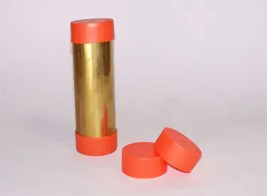 Two stainless steel cylinders are sitting next to each other on a white surface.