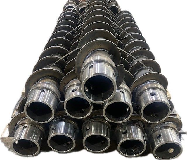 A bunch of metal pipes stacked on top of each other