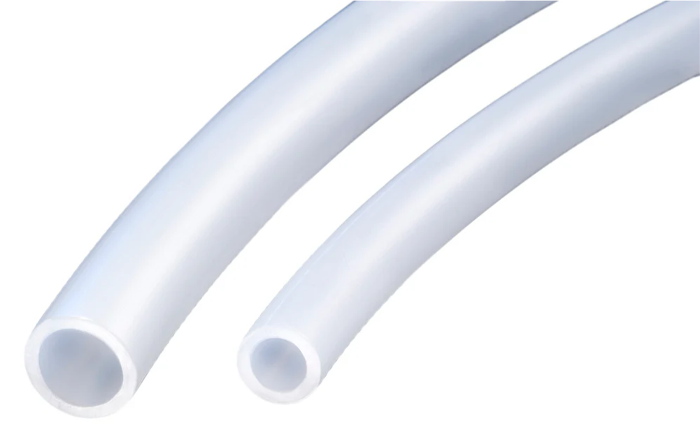 A close up of two white plastic pipes on a white background.