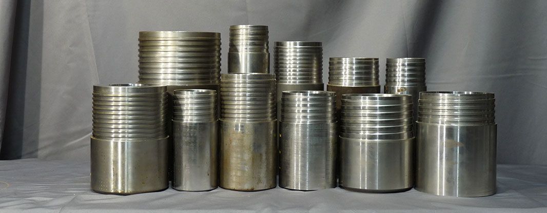 A group of metal cylinders are stacked on top of each other on a table.