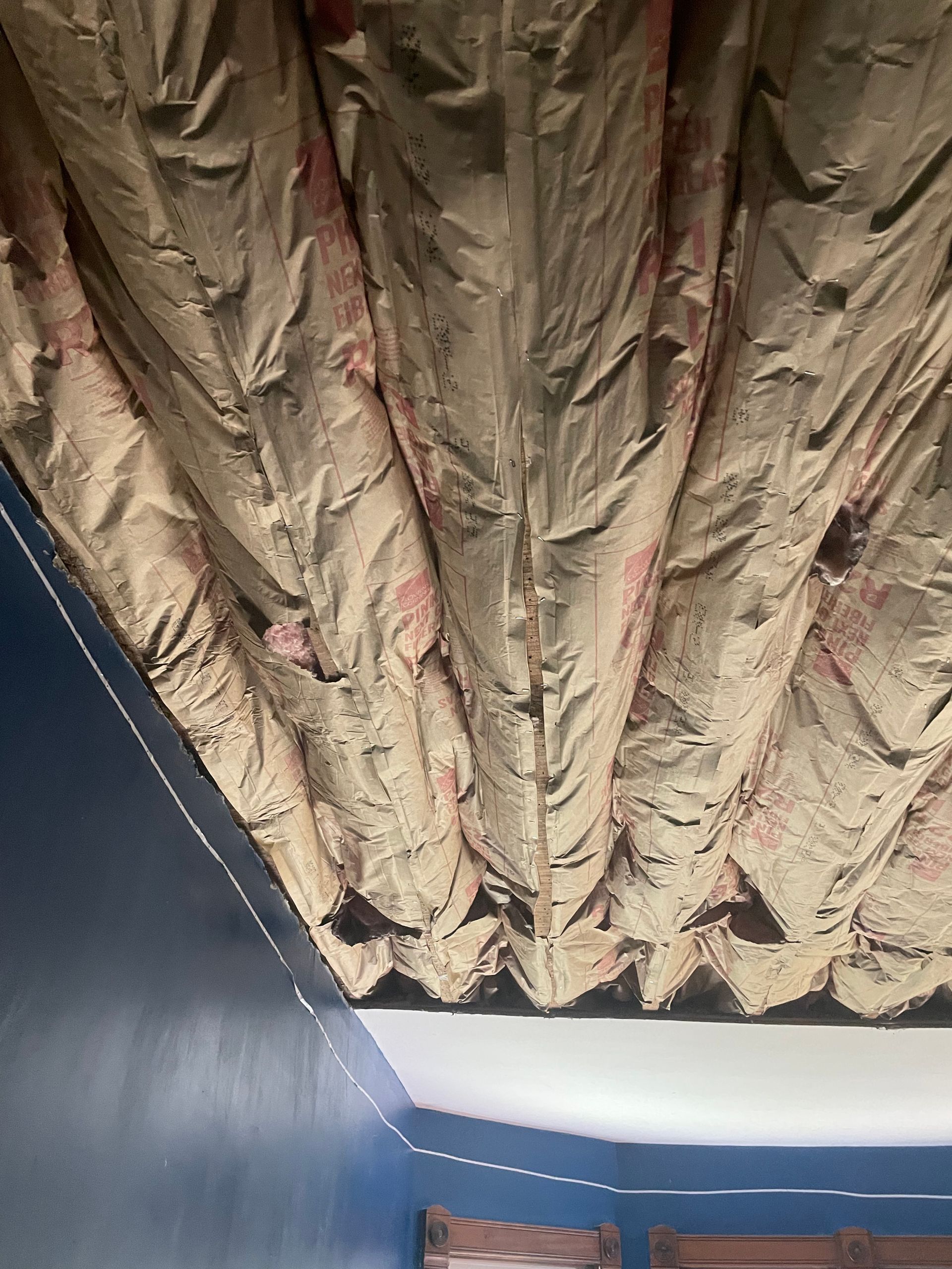 A close up of a ceiling with a lot of insulation on it.