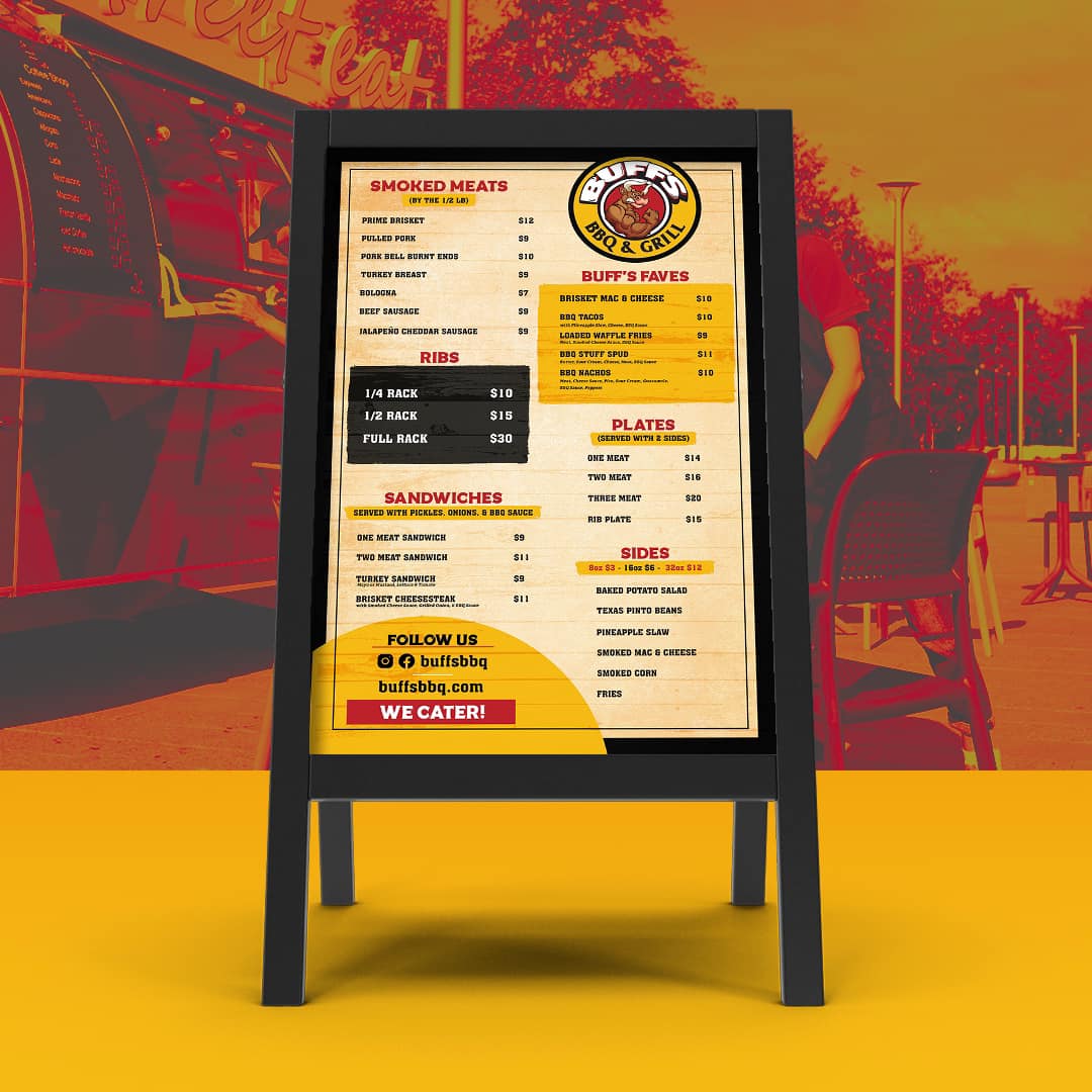 A menu for a restaurant is displayed on an easel