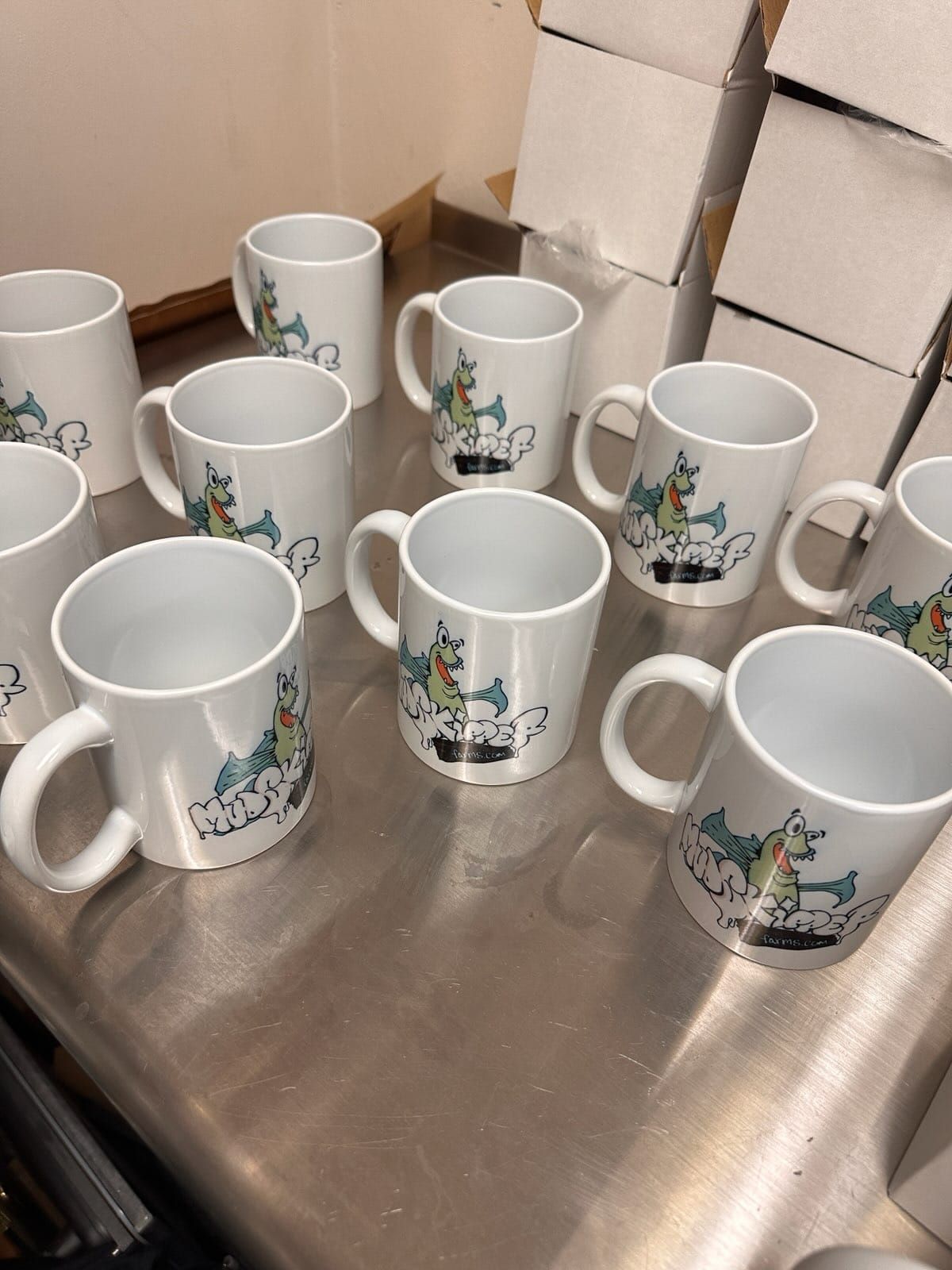 A bunch of coffee mugs are sitting on a counter