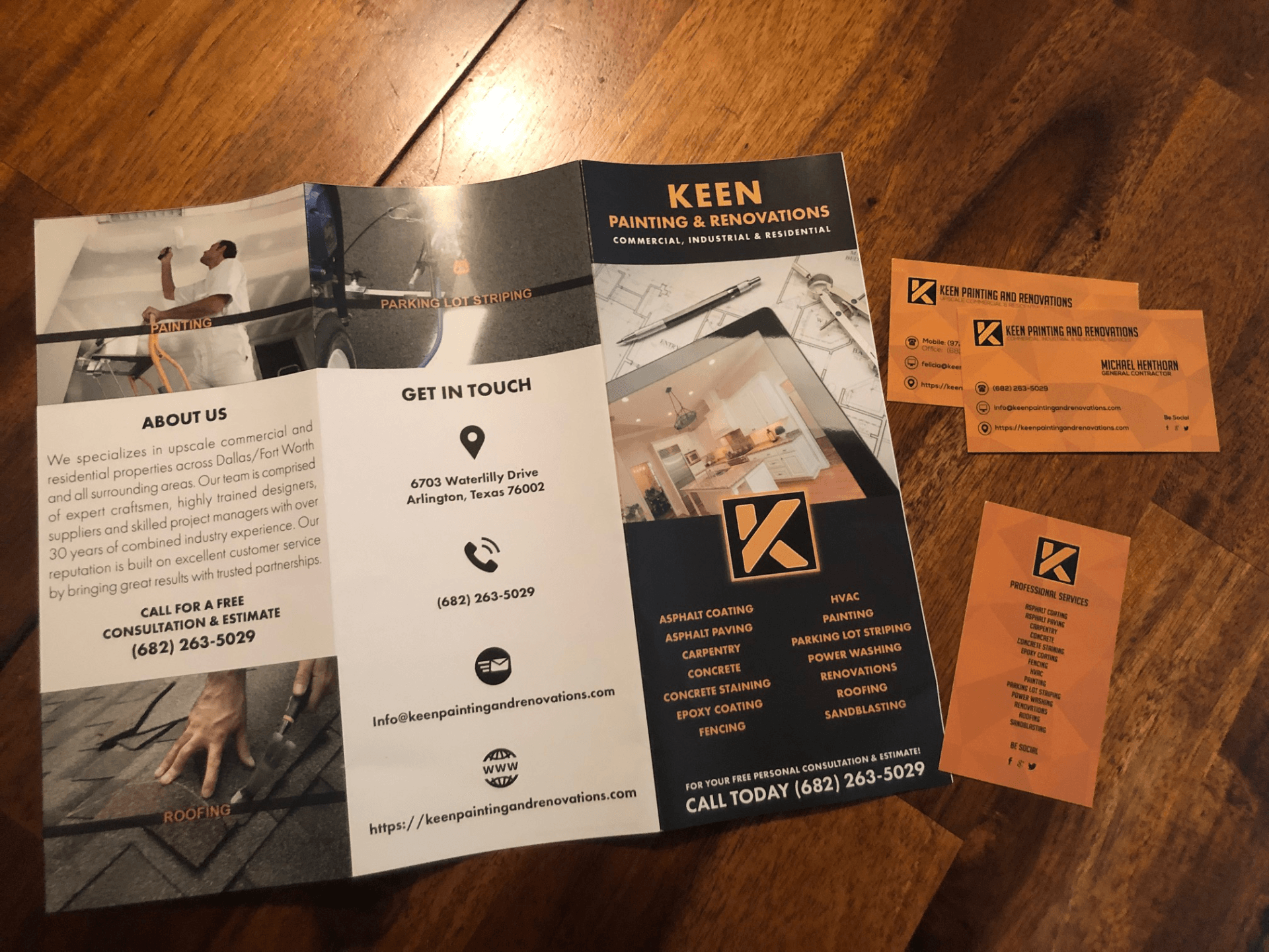 A brochure for a company called keen sits on a wooden table