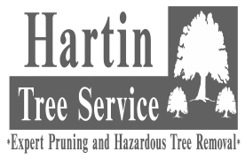 A green and white logo for hartin tree service