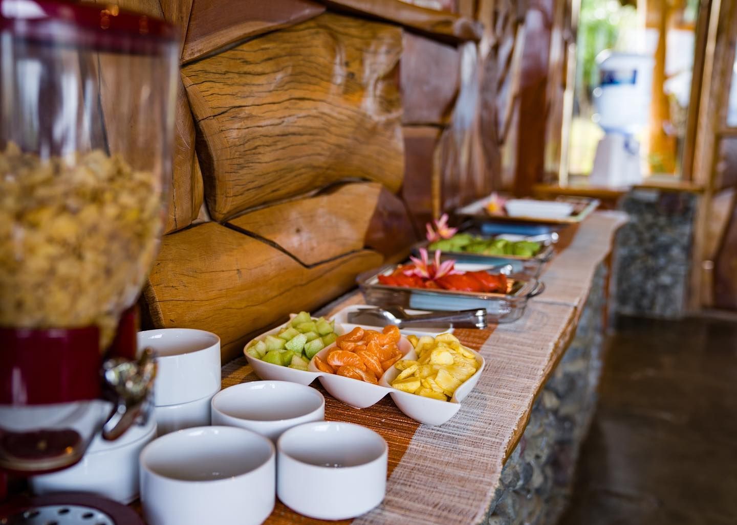 A bedroom with a wooden door and a bed