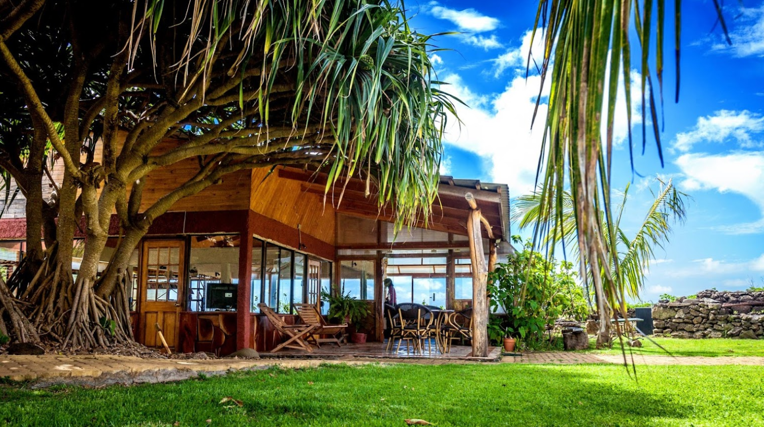 A picture frame is sitting on a counter next to a lamp.