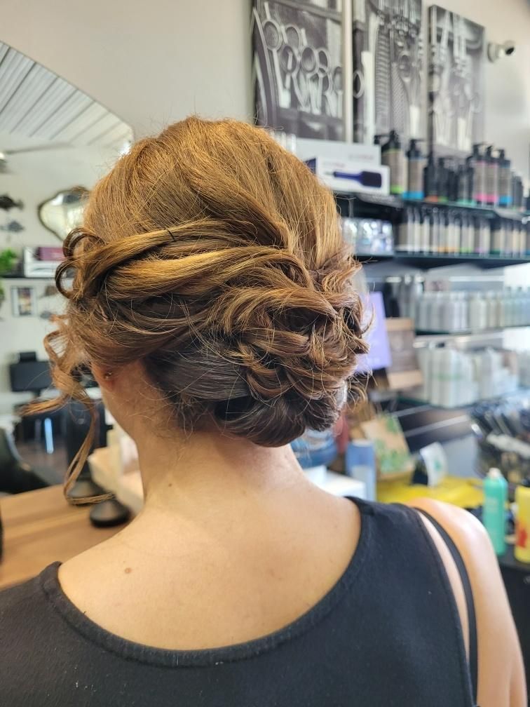 A Woman Is Getting Her Hair Done in A Salon — Eco Village Hair in Bongaree, QLD