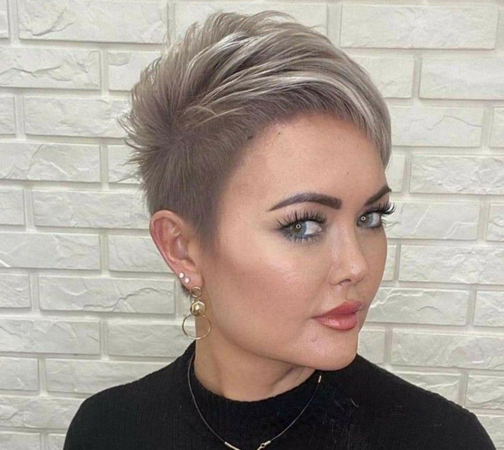 A Woman with Short Hair Is Wearing a Black Shirt and Earrings — Eco Village Hair in Bongaree, QLD