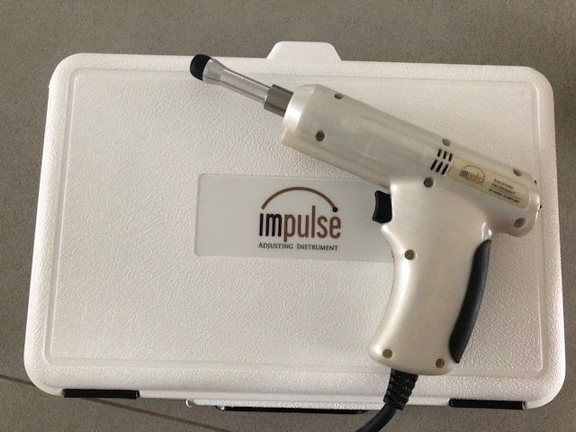 White Impulse Chiropractic Adjusting Tool on a Case — Wide Bay Chiropractic in Gympie, QLD