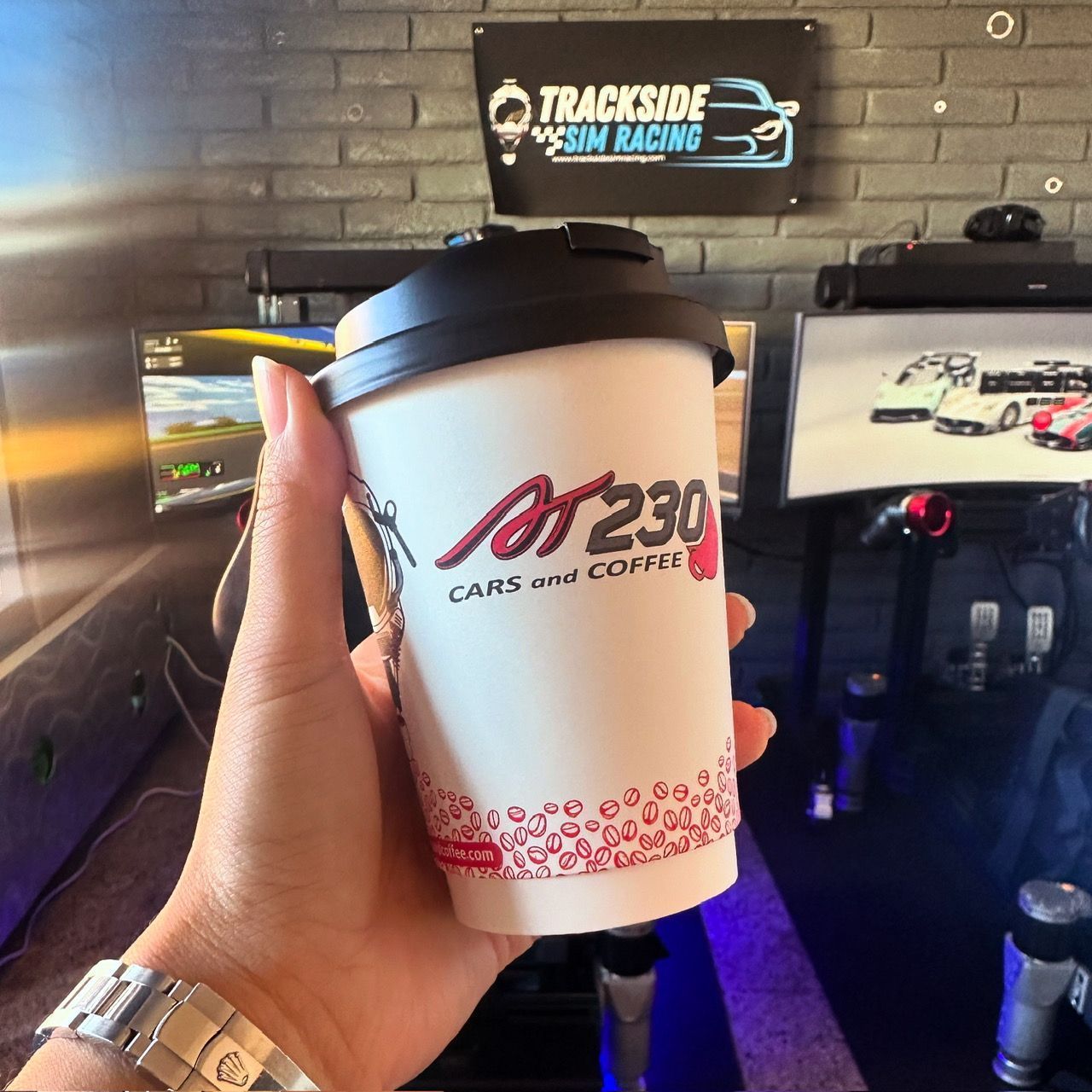 Hand holding coffee cup with 