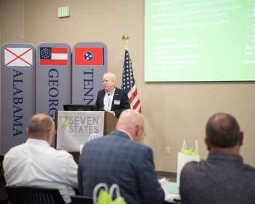 A man is giving a presentation at a 7 seven states conference