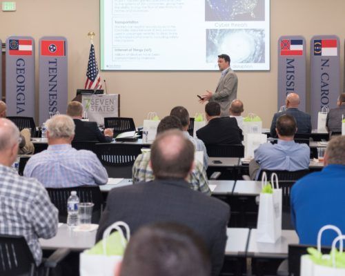 A man is giving a presentation to a group of people