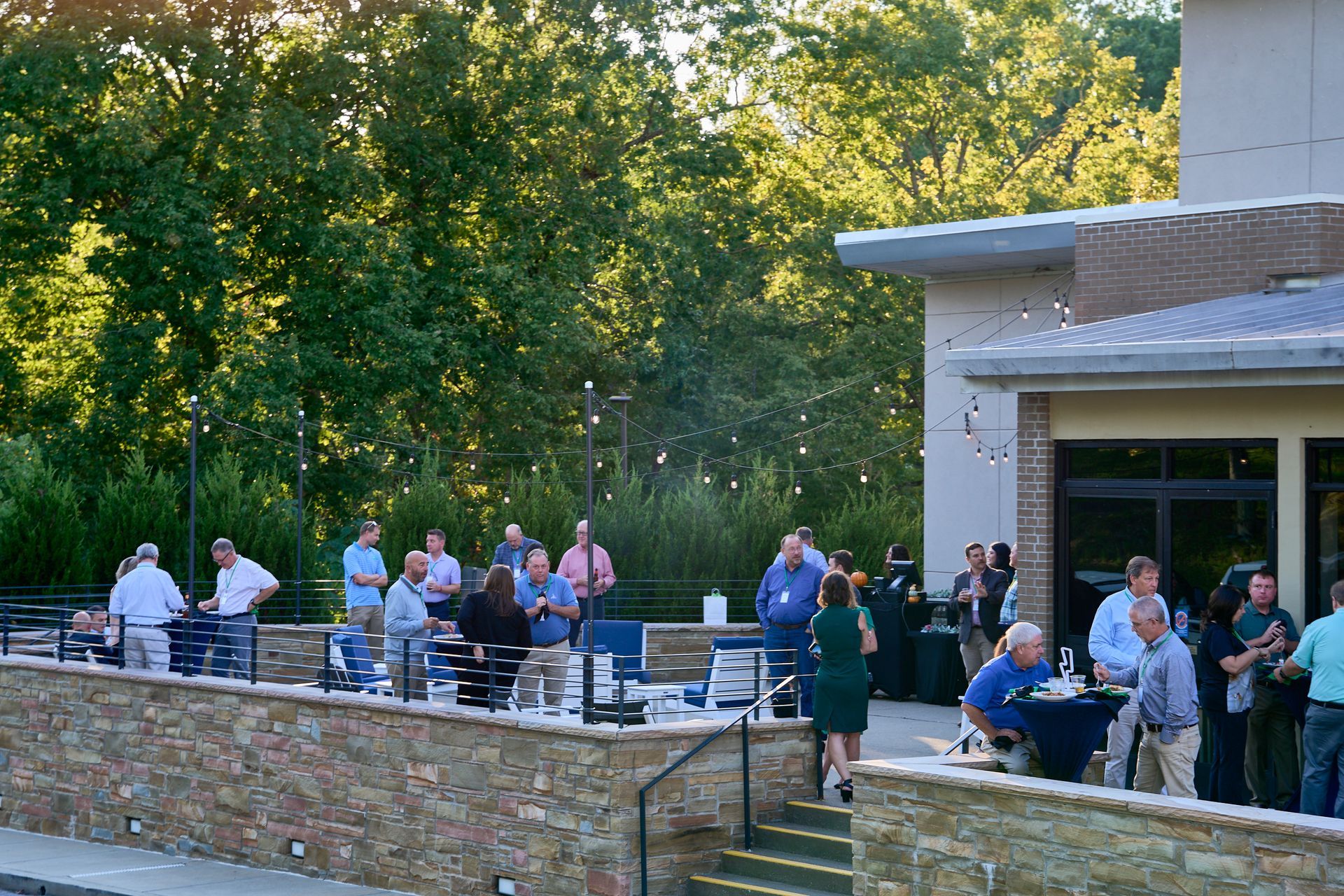 A group of people are standing outside of a building.