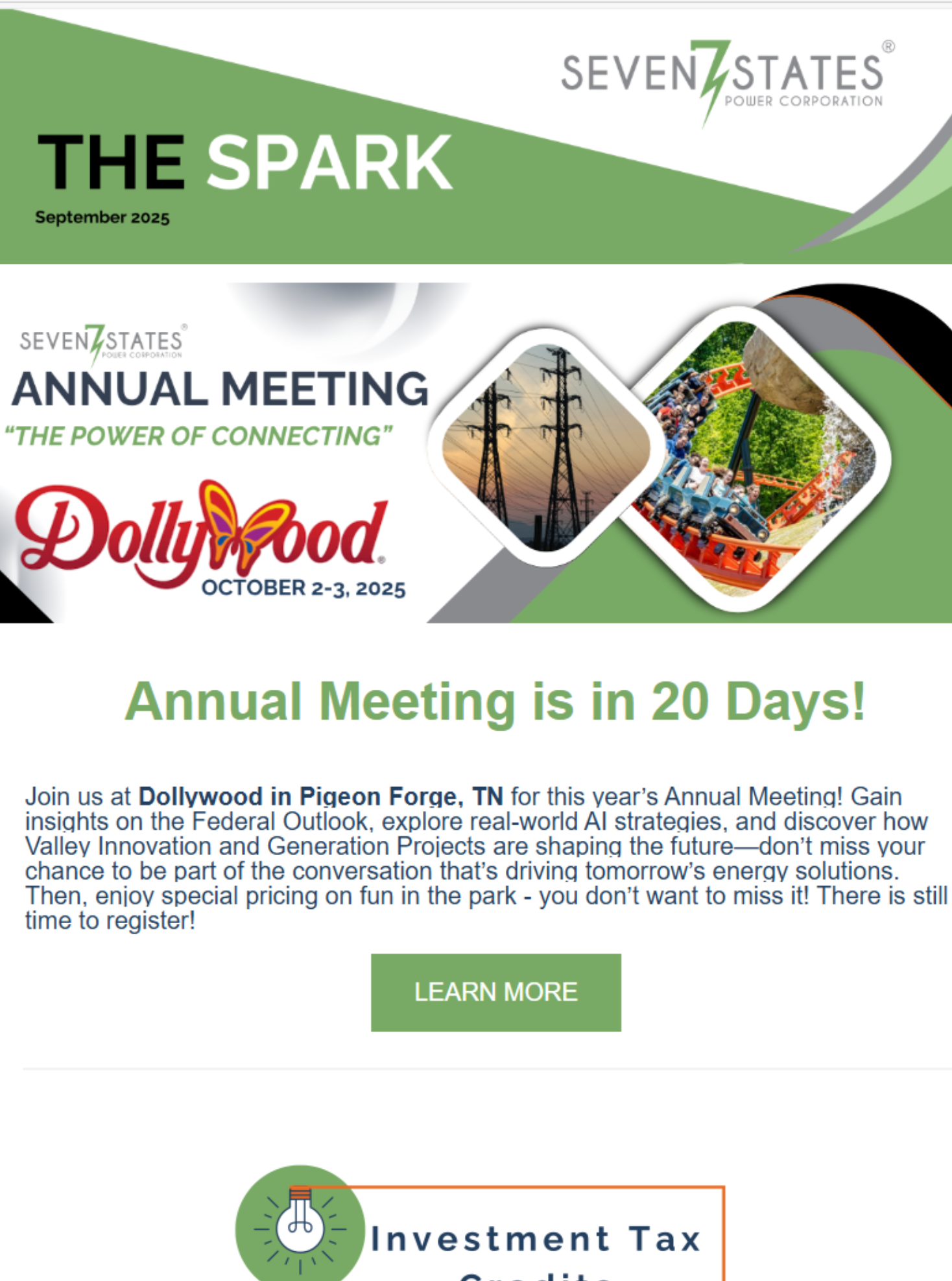 A white shipping container is sitting on top of a lush green field next to solar panels.