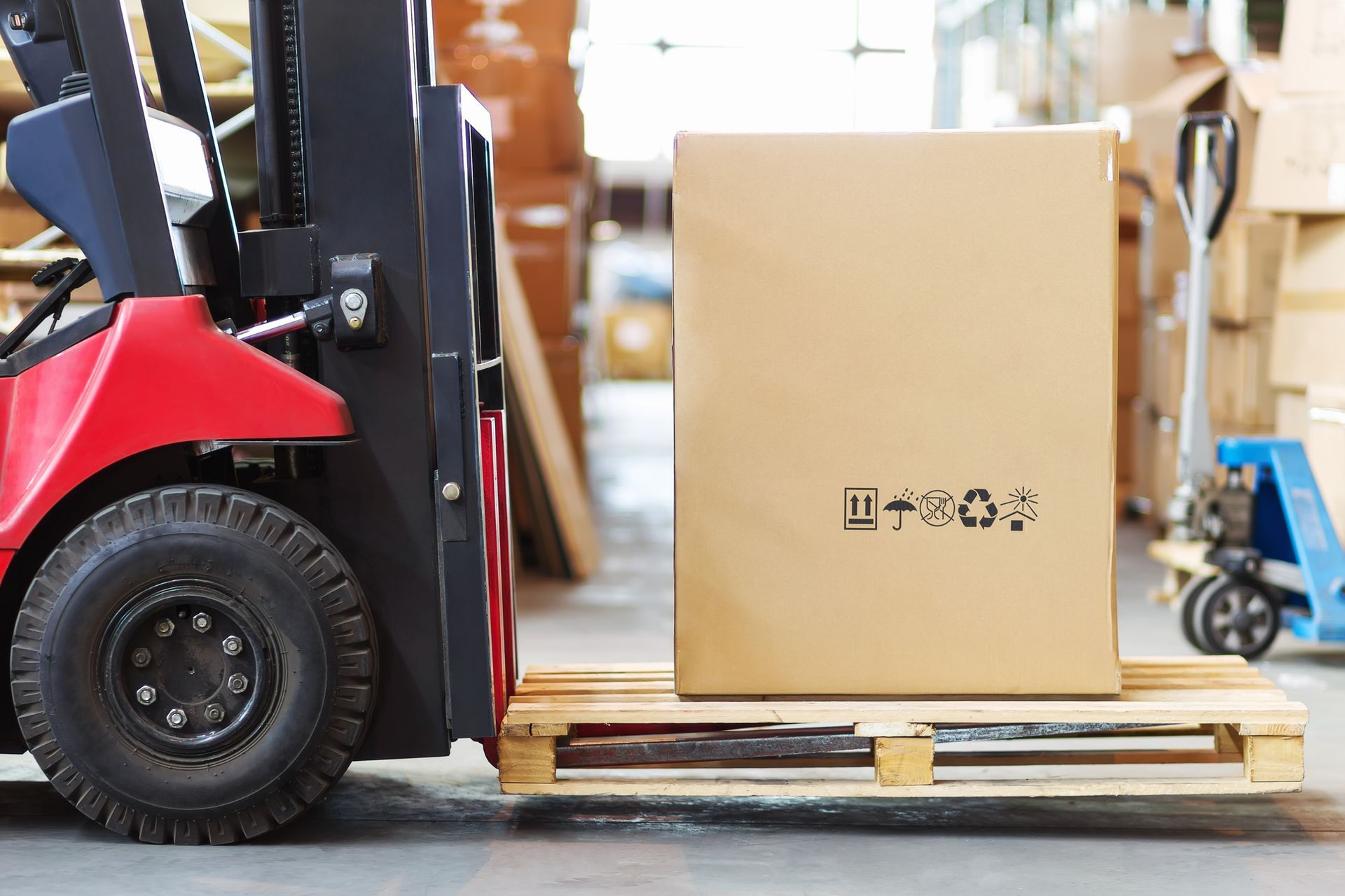 Large box on forklift representing medical equipment movers handling supplies efficiently.