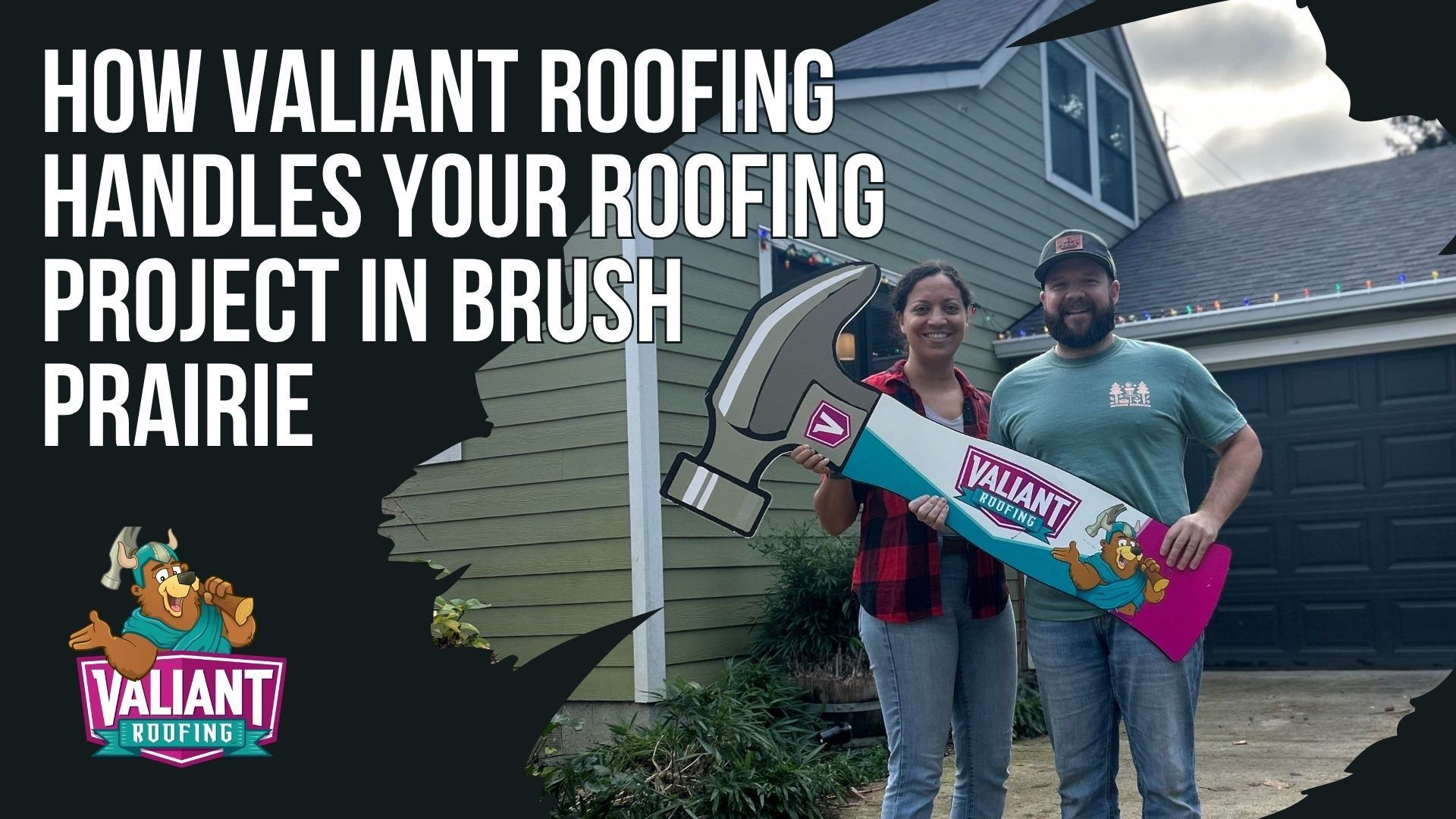 Two people stand in front of a green house holding a large, colorful hammer cutout for a Valiant Roofing advertisement.