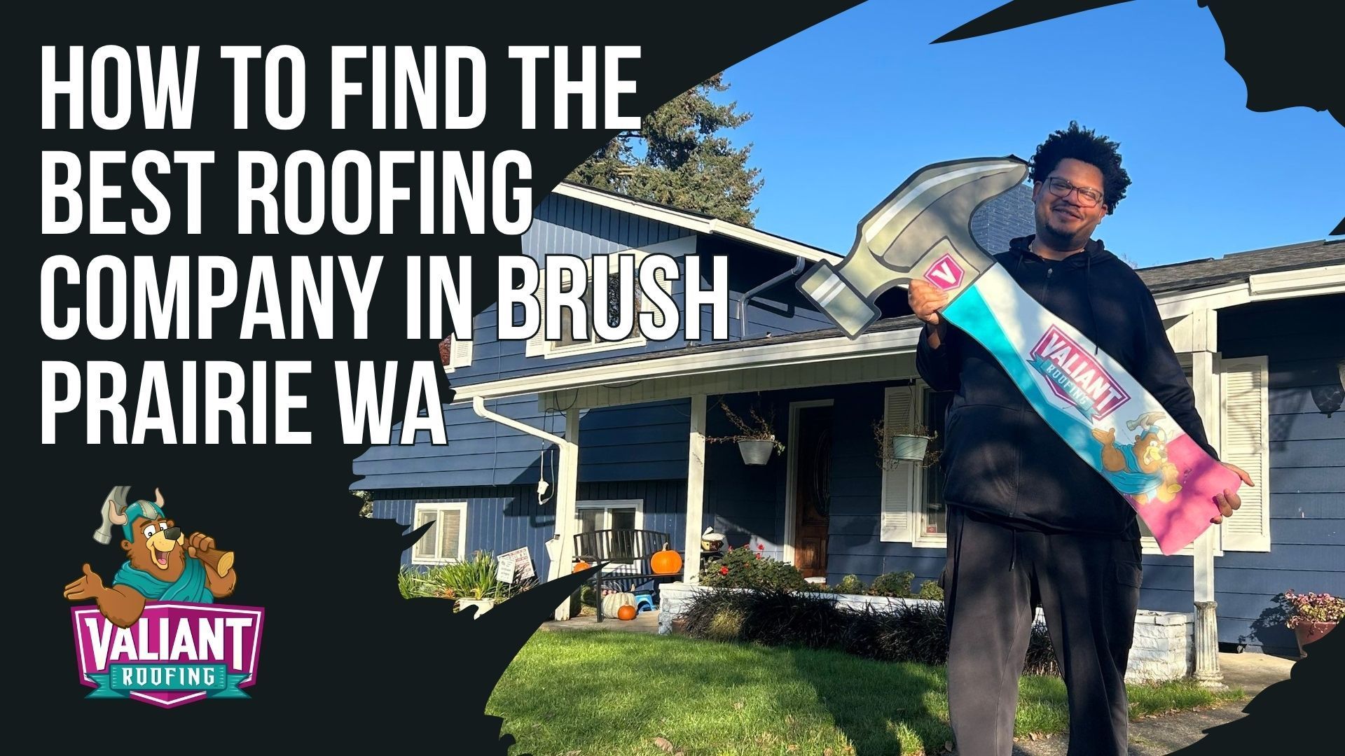 A man holds a large prop hammer in front of a blue house, with text overlay promoting a roofing company in Brush Prairie.