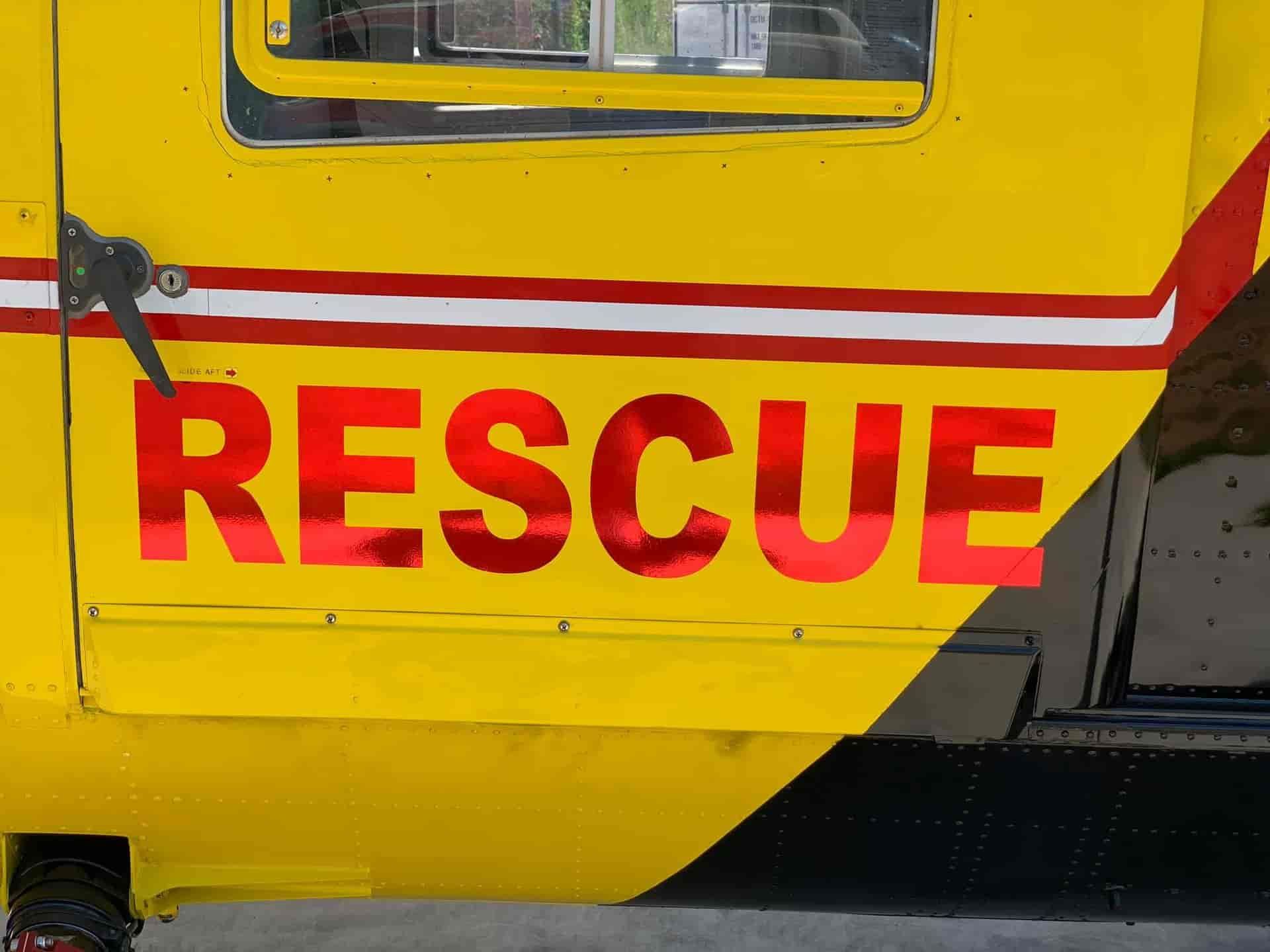 Yellow And Red Rescue Helicopter Door With The Word "Rescue" Prominently Displayed — Cairns Signcorp In Portsmith, QLD