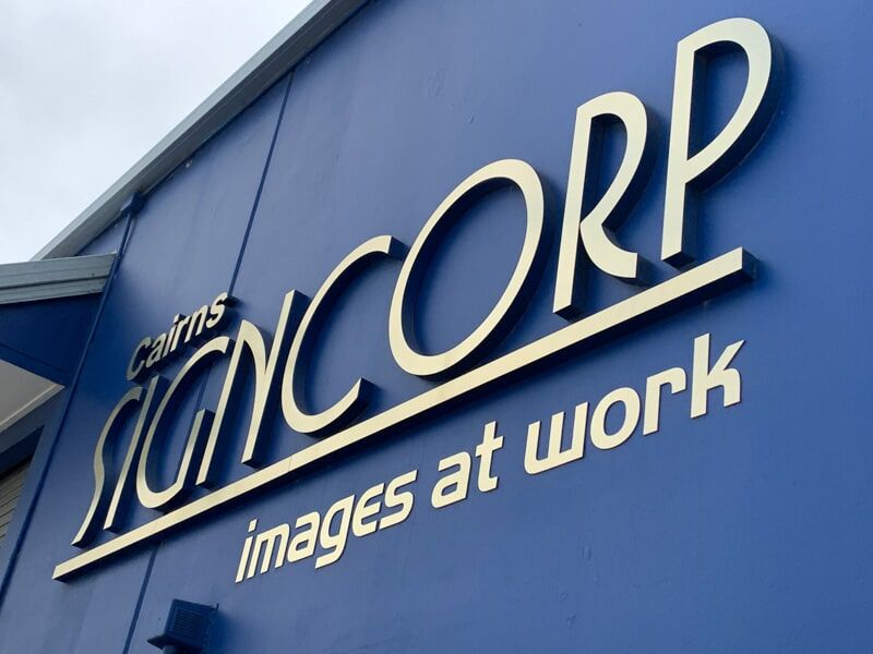 A Blue Sign That Says Signcorp Images At Work — Cairns Signcorp In Portsmith, QLD