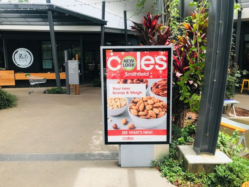 A Sign In Front Of A Building That Says Coles On It — Cairns Signcorp In Portsmith, QLD