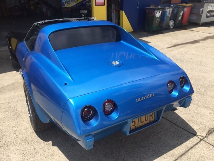 A Blue Corvette Is Parked In A Parking Lot — Cairns Signcorp In Portsmith, QLD