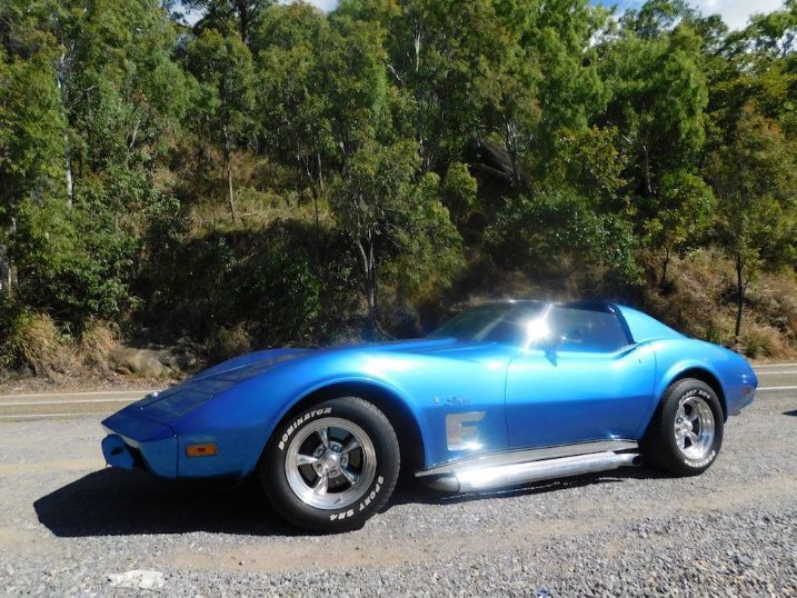 A Blue Corvette Is Parked On The Side Of The Road — Cairns Signcorp In Portsmith, QLD