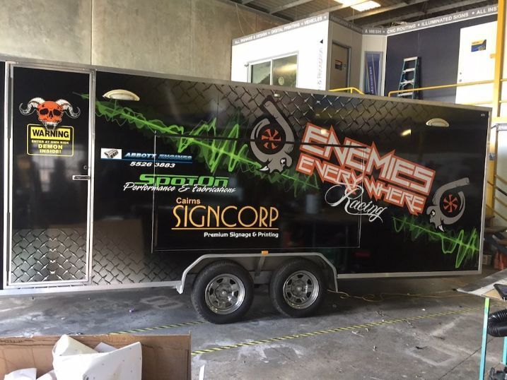 A Trailer With The Words Enemies Everywhere Written On It — Cairns Signcorp In Portsmith, QLD