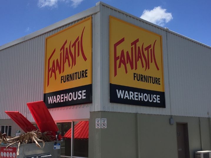 A Fantastic Furniture Warehouse Is Located On The Side Of A Building — Cairns Signcorp In Portsmith, QLD