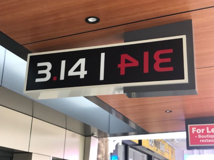 A Sign For 3.14 Pie Hangs From The Ceiling Of A Building — Cairns Signcorp In Portsmith, QLD