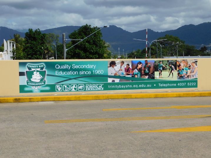 A Sign On A Wall That Says Quality Secondary Education Since 1990 — Cairns Signcorp In Portsmith, QLD