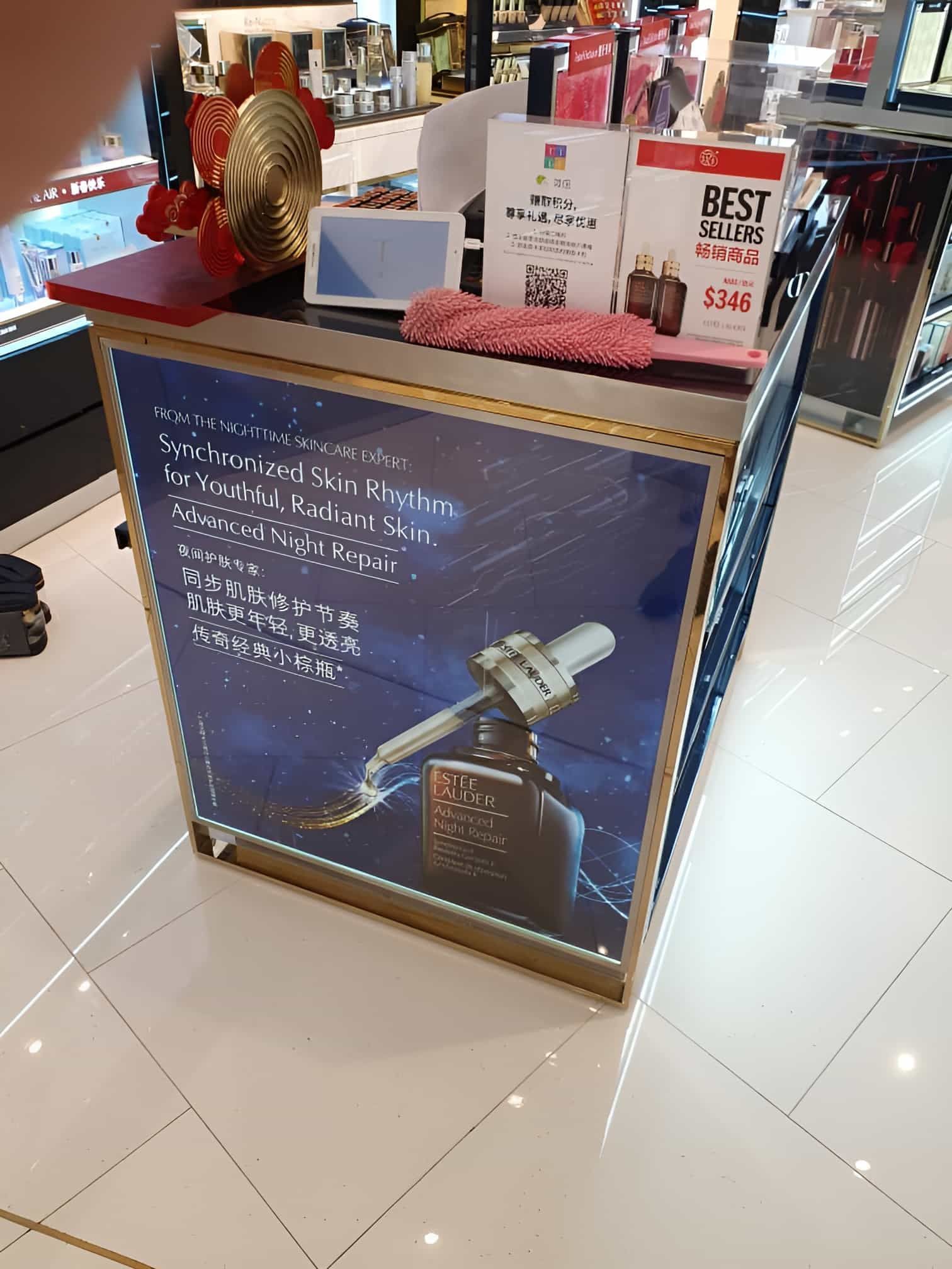 A Counter In A Store With A Bottle Of Perfume On It — Cairns Signcorp In Portsmith, QLD