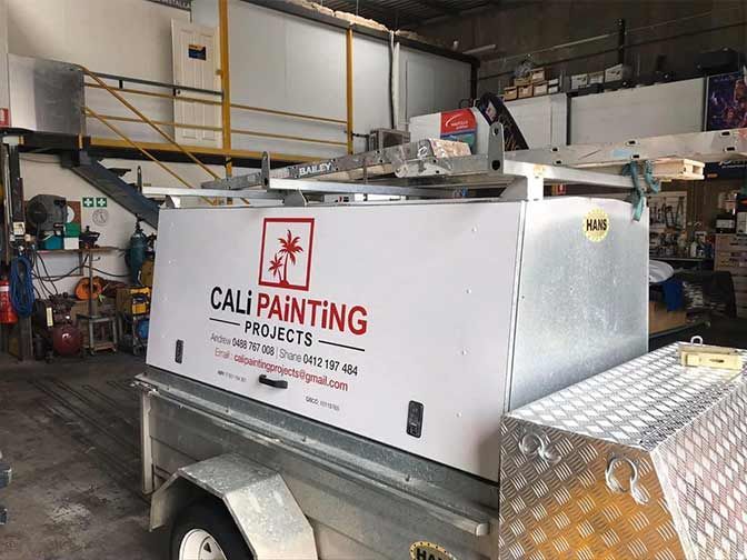 A Trailer For Cali Painting Projects Is Parked In A Garage — Cairns Signcorp In Portsmith, QLD