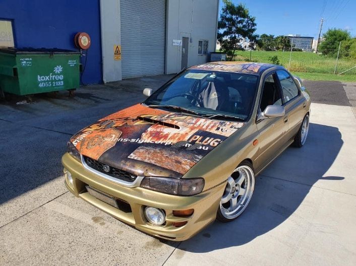 A Car With The Word Plug On The Hood — Cairns Signcorp In Portsmith, QLD