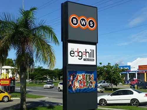 A Sign For Edgehill Is Sitting On The Side Of The Road Next To A Palm Tree — Cairns Signcorp In Portsmith, QLD