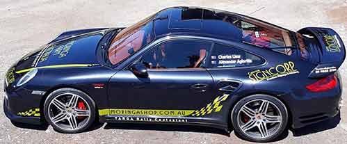 A Sports Car Is Parked On The Side Of The Road — Cairns Signcorp In Portsmith, QLD