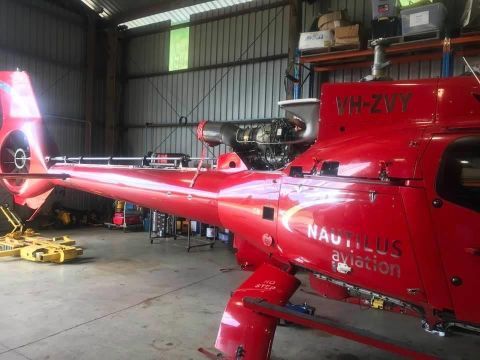 A Red Helicopter With The Letters VH-ZVY On The Side — Cairns Signcorp In Portsmith, QLD