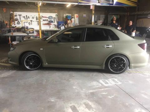 A Grey Car Is Parked In A Garage — Cairns Signcorp In Portsmith, QLD